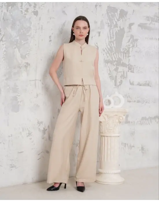 Broşlu yelek pantolon takım bej s255821