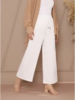 Omarı Bol Paça Beli Lastikli Beyaz Pantolon