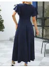 Kadın Kısa Kollu Kruvaze Yakalı ön Asimetrik Volanlı Uzun Ithal Krep Elbise