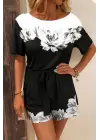Kadın Tek Omuzu Açık çiçek Desenli Beli Kuşaklı Iki Iplik Mini Short Tulum