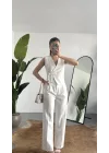 Kadın Beyaz Asimetrik Kesim Kruvaze Bağlamalı Yelek ,Pileli Plazzo Pantolon Takım