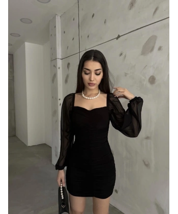 Kolu tül büzgülü elbise