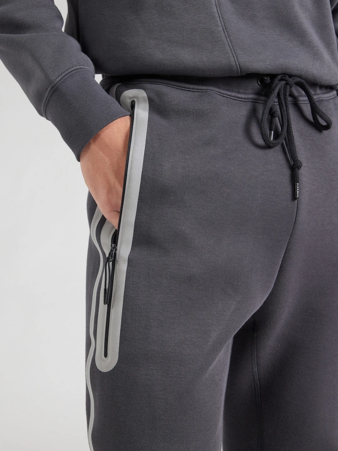 Tech Fleece Windrunner REFLECTIVE Jogger – Antrasit/Turuncu
