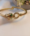 Euro Aksesuar 14K Altın Kaplama Yeşil Gözlü Panter Detaylı Çelik Kelepçe Bileklik