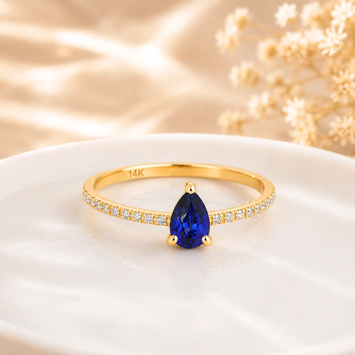 0.32 Carat Pear Cut Sapphire Diamond Ring