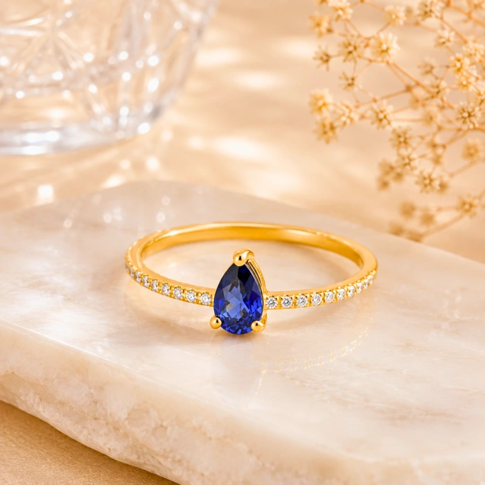 0.32 Carat Pear Cut Sapphire Diamond Ring
