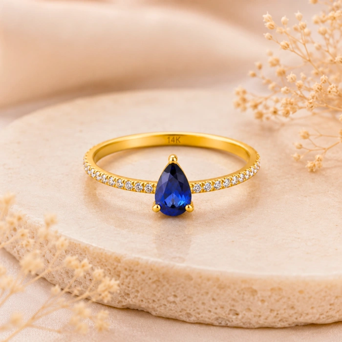 0.32 Carat Pear Cut Sapphire Diamond Ring