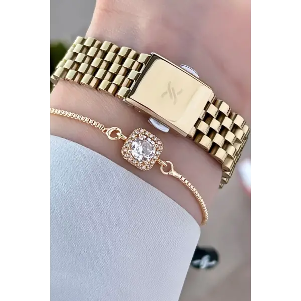 Daniel Klein DKISTE1014 Gold Renk Hediye Paketli Kadın Kol Saati ve Bileklik