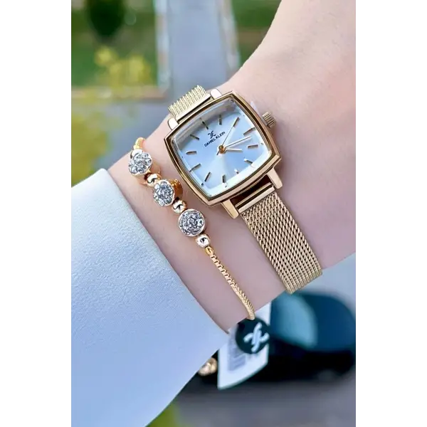 Daniel Klein DKISTE1220 Kadranı Gümüş Kordonu Gold Renk Hediye Paketli Kadın Kol Saati ve Bileklik