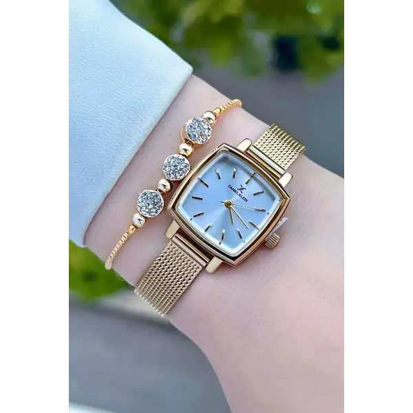 Daniel Klein DKISTE1220 Kadranı Gümüş Kordonu Gold Renk Hediye Paketli Kadın Kol Saati ve Bileklik