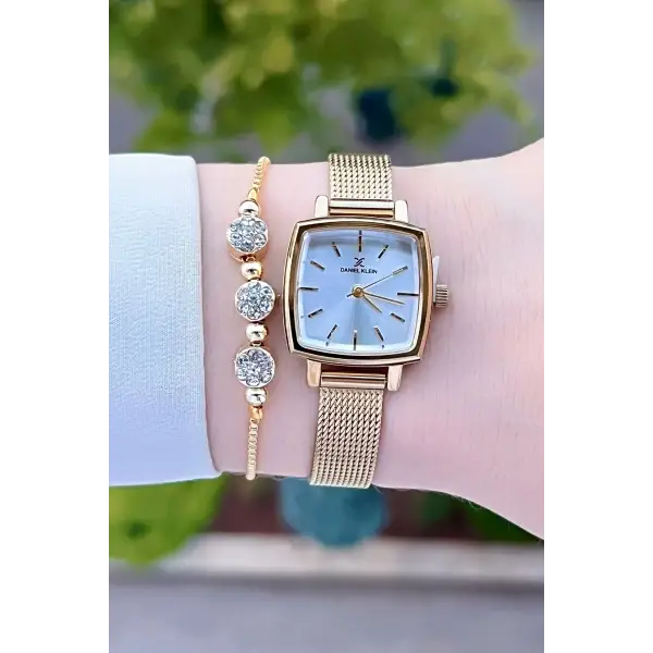 Daniel Klein DKISTE1220 Kadranı Gümüş Kordonu Gold Renk Hediye Paketli Kadın Kol Saati ve Bileklik