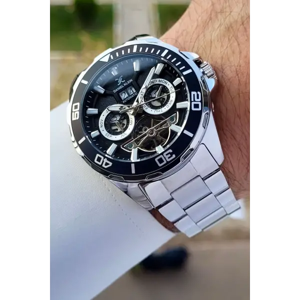 Daniel Klein DKISTE1261 Kadranı Siyah Kordonu Gümüş Renk Otomatik Takvimli Hediye Paketli Erkek Kol Saati