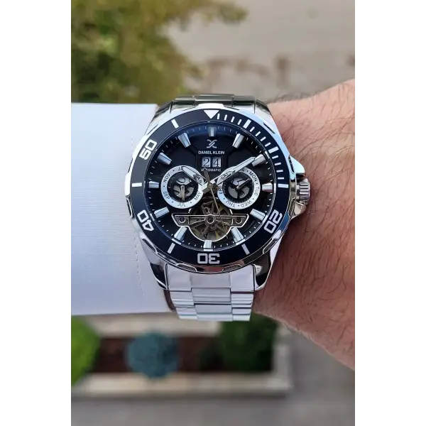 Daniel Klein DKISTE1261 Kadranı Siyah Kordonu Gümüş Renk Otomatik Takvimli Hediye Paketli Erkek Kol Saati