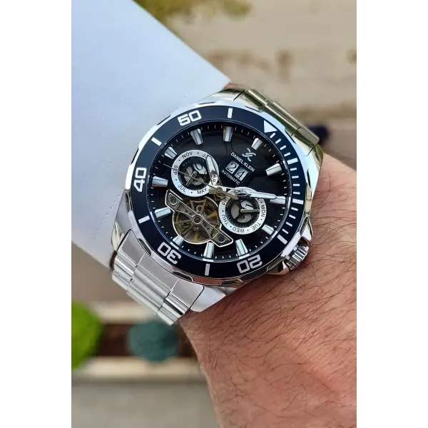 Daniel Klein DKISTE1261 Kadranı Siyah Kordonu Gümüş Renk Otomatik Takvimli Hediye Paketli Erkek Kol Saati