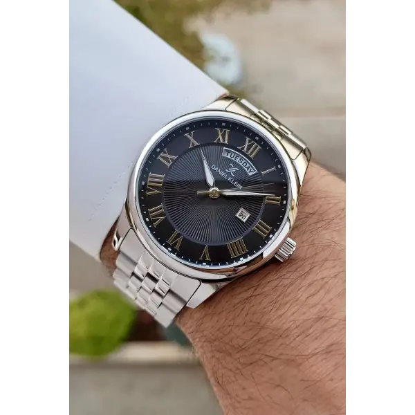 Daniel Klein DKISTE1287 Kadranı Siyah Kordonu Gümüş Renk Takvim ve Gün Fonksiyonlu Hediye Paketli Erkek Kol Saati