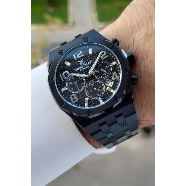 Daniel Klein DKISTE1389 Rakamları Gümüş Kordonu Siyah Renk Hediye Paketli Göstergeleri Aktif Erkek Kol Saati