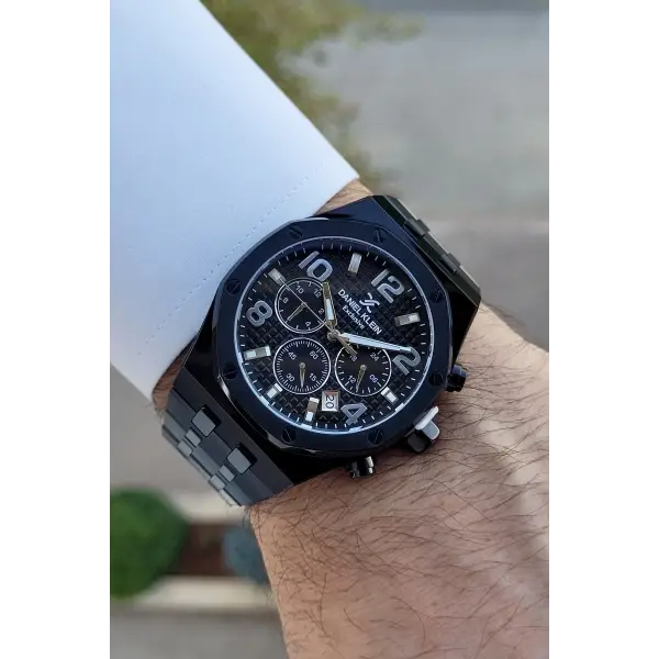 Daniel Klein DKISTE1389 Rakamları Gümüş Kordonu Siyah Renk Hediye Paketli Göstergeleri Aktif Erkek Kol Saati