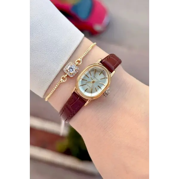 Kasası Gold Kordonu Kahverengi Renk Hediye Paketli 20 Mm 5 ATM Kadın Kol Saati