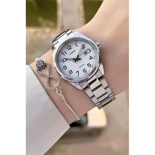 Casio CSISTE173 Kadranı Beyaz Kordonu Metalik Renk 2 Yıl Garantili Kadın Kol Saati