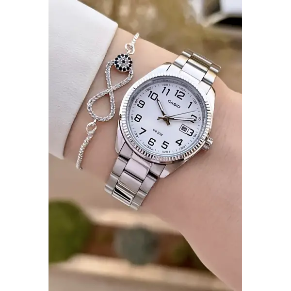 Casio CSISTE173 Kadranı Beyaz Kordonu Metalik Renk 2 Yıl Garantili Kadın Kol Saati