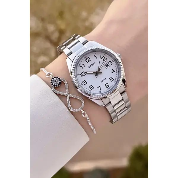 Casio CSISTE173 Kadranı Beyaz Kordonu Metalik Renk 2 Yıl Garantili Kadın Kol Saati