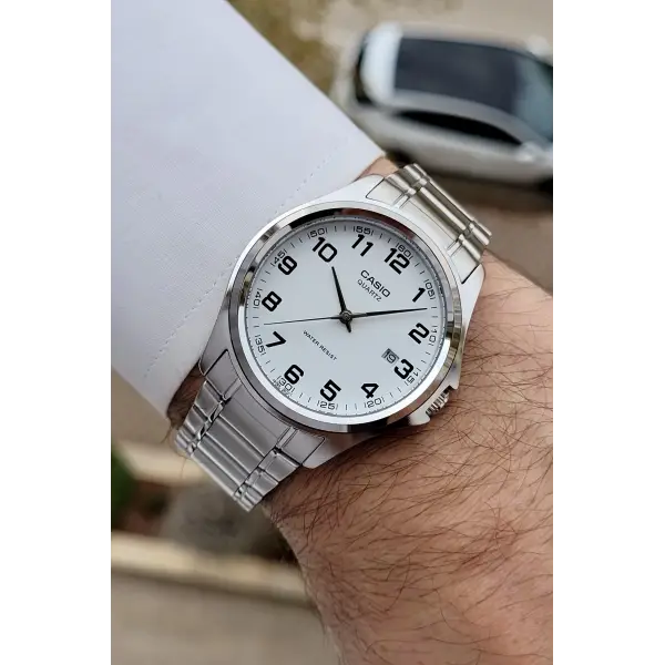 Casio CSISTE198 Kadranı Beyaz Rakamlı Kordonu Metalik Renk 2 Yıl Garantili Erkek Kol Saati