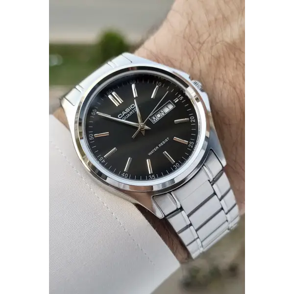Casio CSISTE94 Kadranı Siyah Kordonu Gümüş Renk Gün ve Takvim Fonksiyonlu Hediye Paketli Erkek Kol Saati