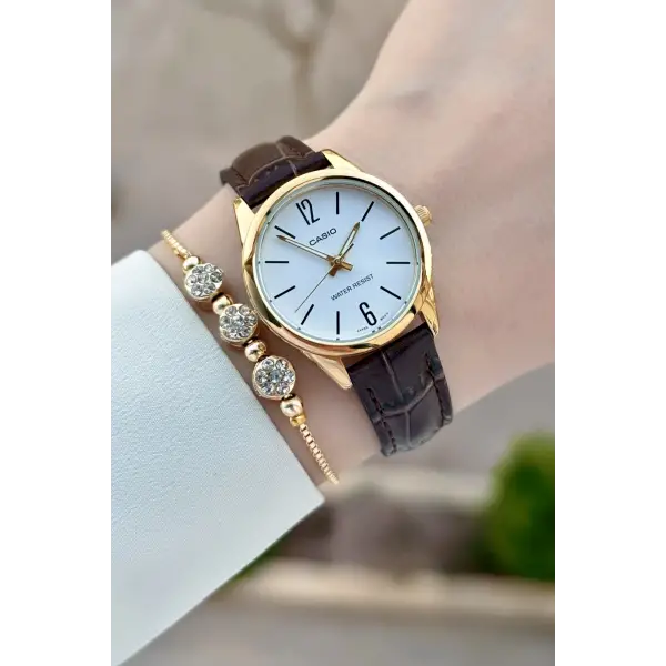 Casio CSISTE217 Casio Kasası Gold Kordonu Kahverengi Renk Hediye Paketli Kadın Kol Saati