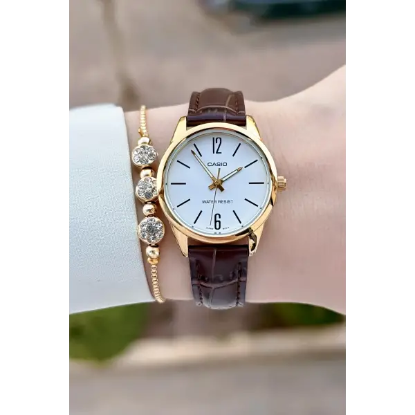 Casio CSISTE217 Casio Kasası Gold Kordonu Kahverengi Renk Hediye Paketli Kadın Kol Saati