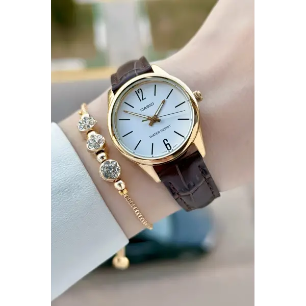 Casio CSISTE217 Casio Kasası Gold Kordonu Kahverengi Renk Hediye Paketli Kadın Kol Saati