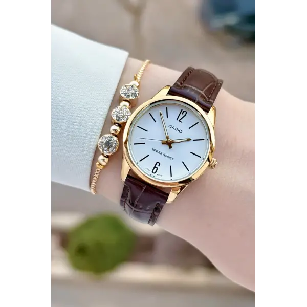 Casio CSISTE217 Casio Kasası Gold Kordonu Kahverengi Renk Hediye Paketli Kadın Kol Saati
