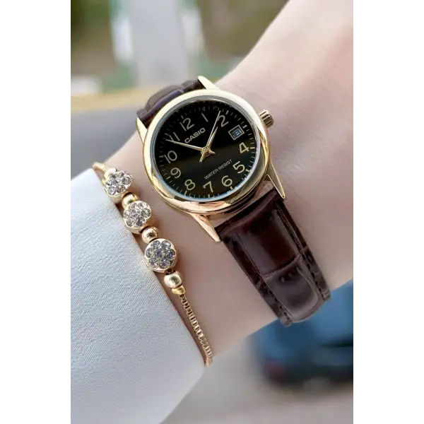 Casio CSISTE214 Casio Kasası Gold Kordonu Kahverengi Renk Takvimli Hediye Paketli Kadın Kol Saati