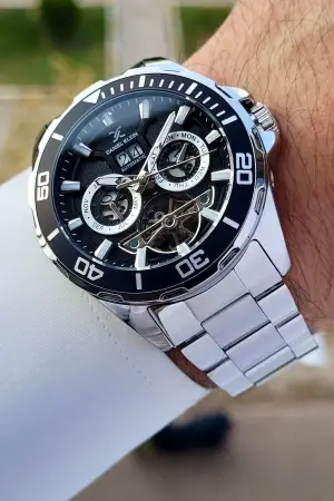 Daniel Klein DKISTE1261 Kadranı Siyah Kordonu Gümüş Renk Otomatik Takvimli Hediye Paketli Erkek Kol Saati