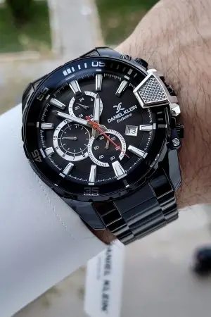 Daniel Klein DKISTE1437 Yazıları Gümüş Kordonu Siyah Renk Göstergeli Erkek Kol Saati