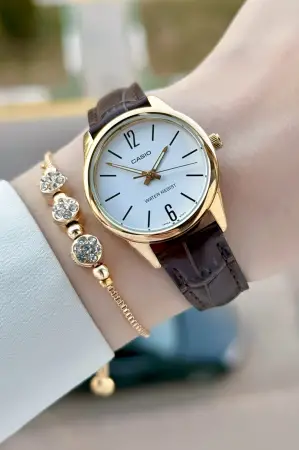 Casio CSISTE217 Casio Kasası Gold Kordonu Kahverengi Renk Hediye Paketli Kadın Kol Saati