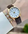 Casio CSISTE217 Casio Kasası Gold Kordonu Kahverengi Renk Hediye Paketli Kadın Kol Saati