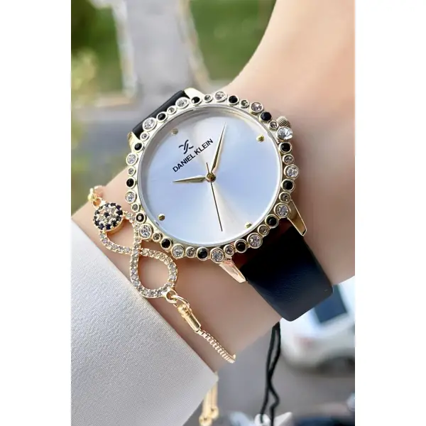 Daniel Klein DKISTE760 Kasası Gold Kordonu Siyah Renk Deri Kordon Kadın Kol Saati Ve Bileklik