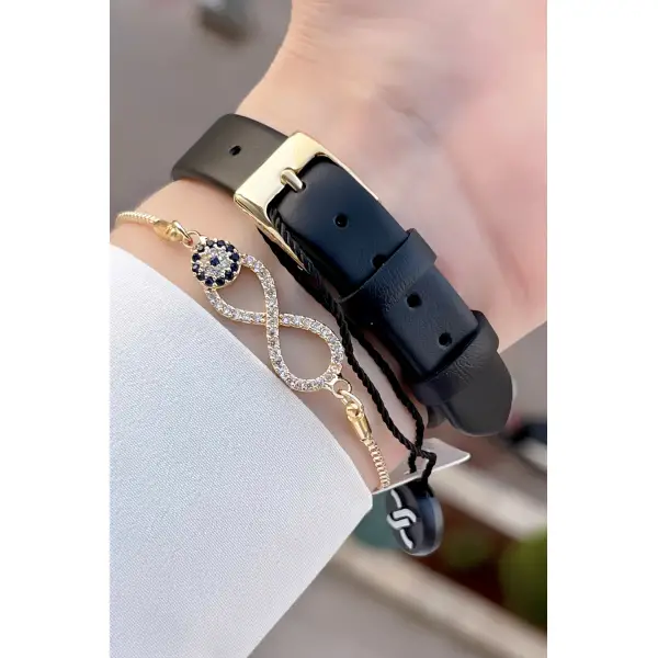 Daniel Klein DKISTE760 Kasası Gold Kordonu Siyah Renk Deri Kordon Kadın Kol Saati Ve Bileklik